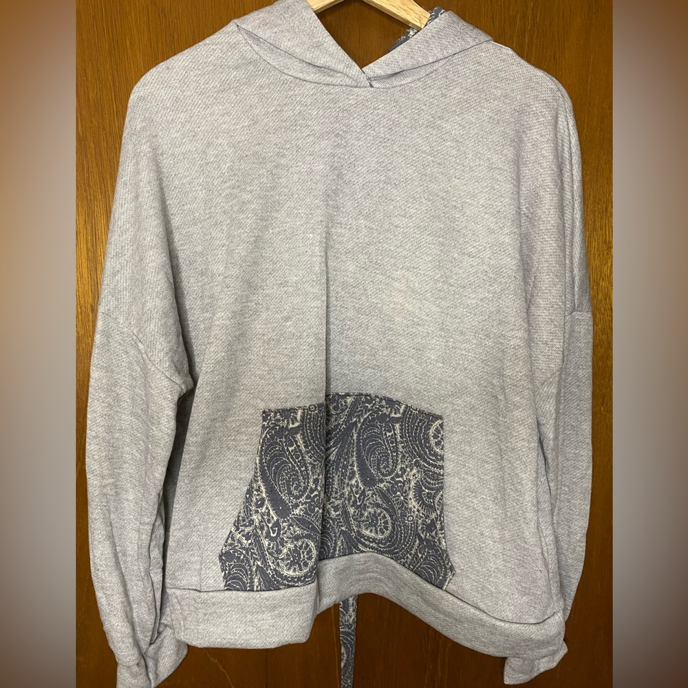 New. Heather Grey hoodie.  Laces in the back.